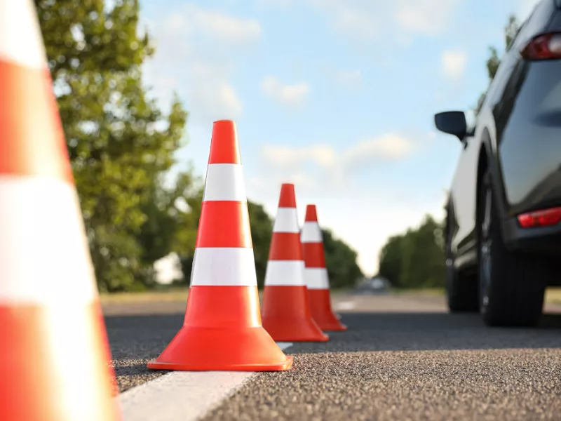 car parked near orange cones