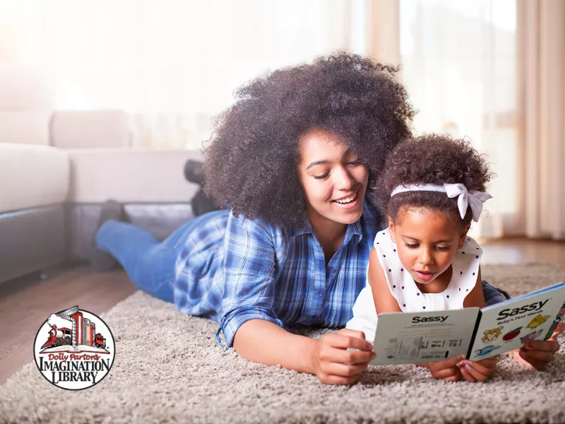 mom reading to daughter