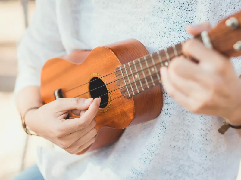 Woman playing ukuelele