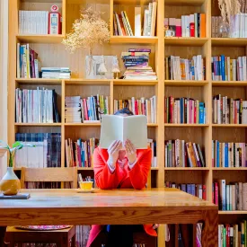 woman reading in library