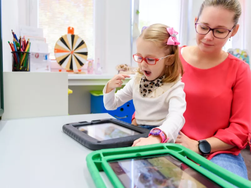 Mom and daughter learning on tablet