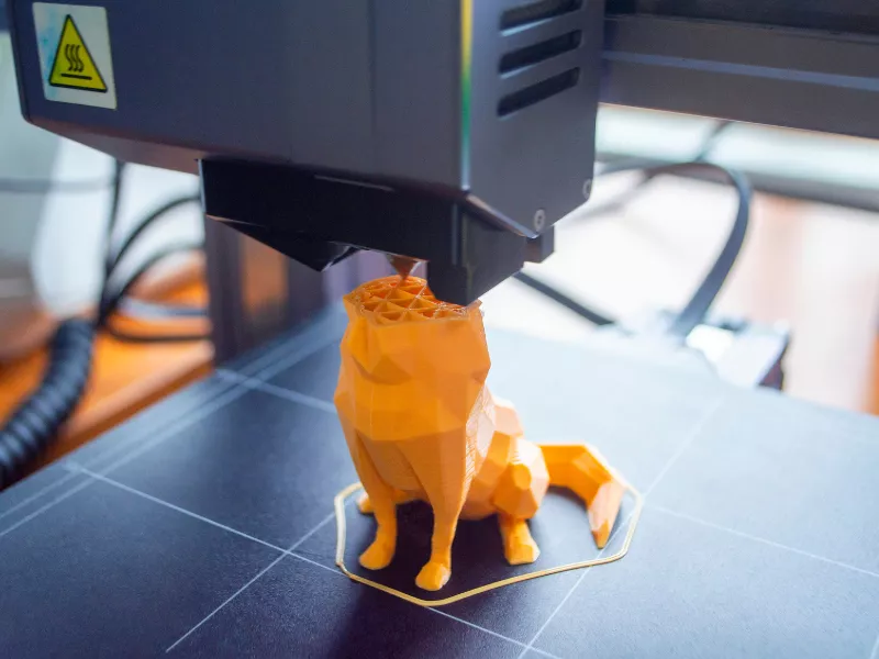 yellow wolf being 3D printed